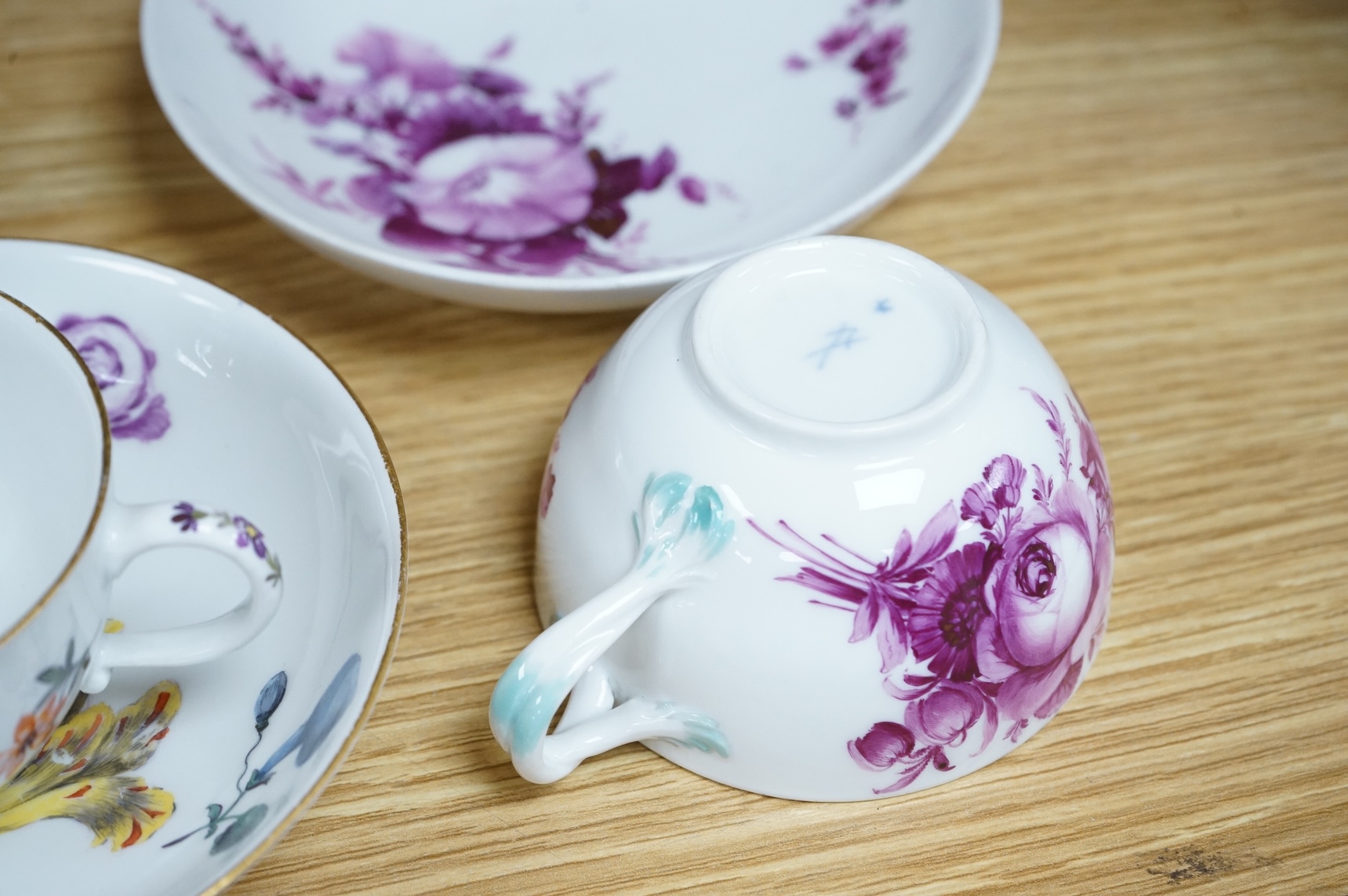 Two 18th century Meissen floral decorated teacups and saucers, largest saucer 13.5cm diameter